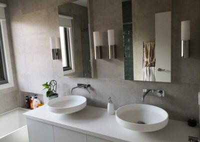 bathroom double basin circular with mirrors above