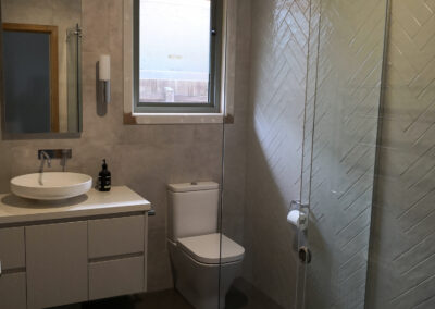 picture of bathroom, with two different feature walls