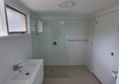 bathroom white with grey floor tiles